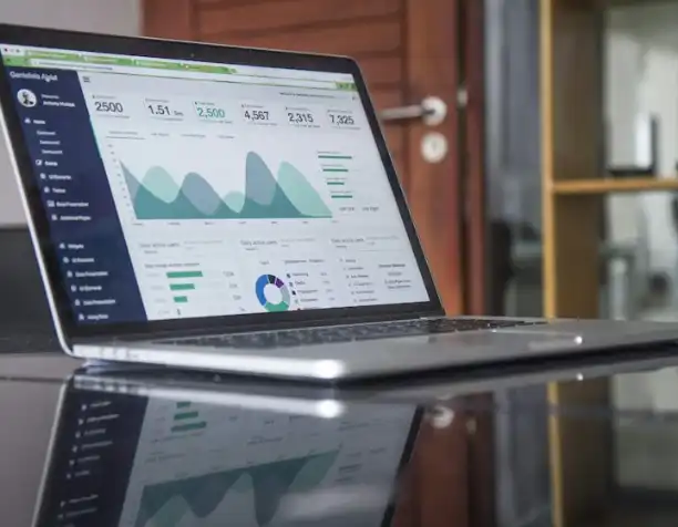 A laptop showing analytics charts